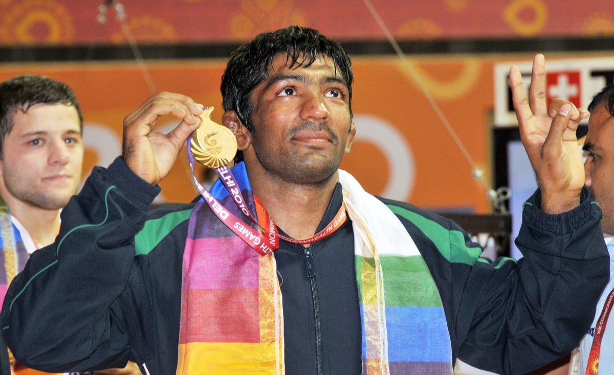 Indian wrestler celebrating a gold medal at the Indira Gandhi Stadium wrestling venue, Delhi 2010